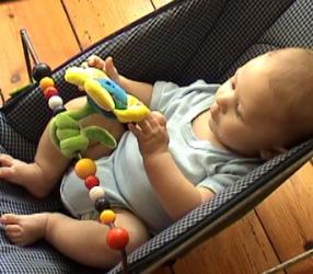 W 4m playing hands in bouncy chair (1).jpg